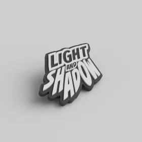 Raw2Rare Light & Shadow Softgummi-Pin als Studioaufnahme auf neutralem Hintergrund